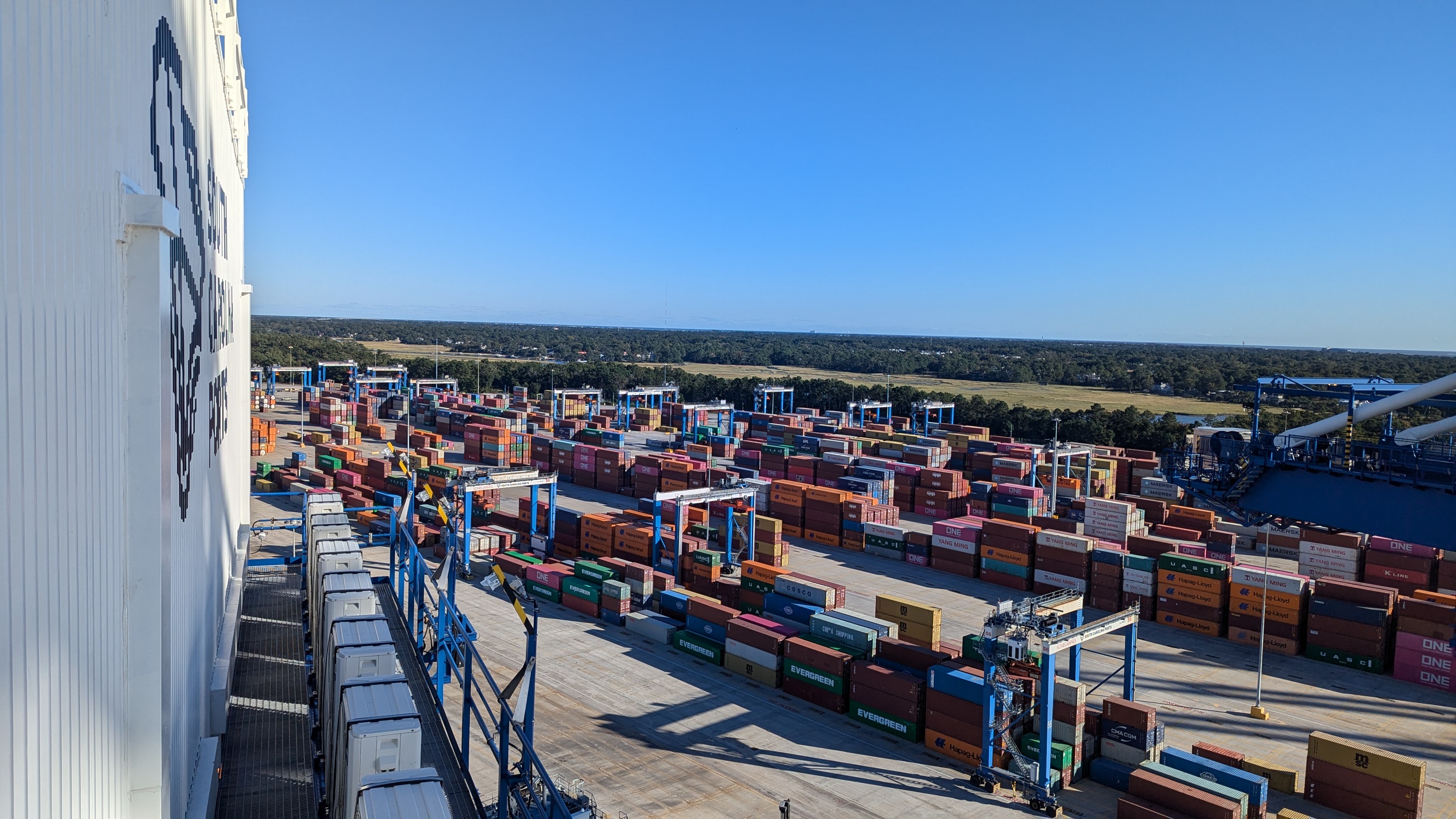 Intermodal container yard with stacked containers and cranes